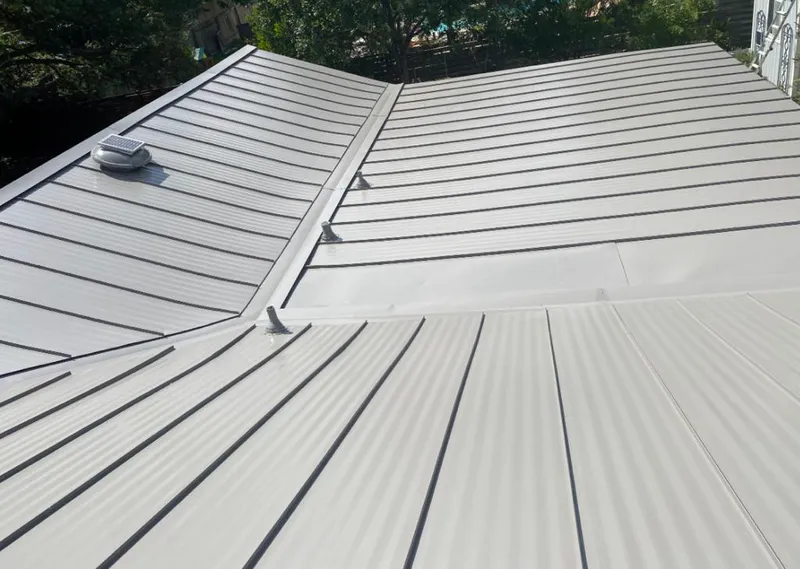 Solar attic fan installed on a metal roof for Roof Ventilation in Wellington